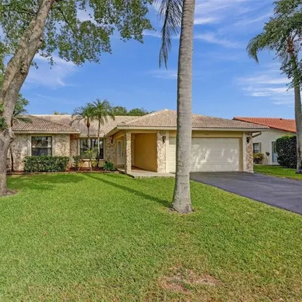 Buy this 4 bed house on 4830 Nw 92nd Ter in Coral Springs, Florida