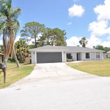 Buy this 3 bed house on 907 Lynbrook Street Northwest in Palm Bay, FL 32907