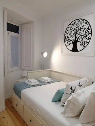 Rent this 2 bed room on Rua de Bartolomeu Costa 26 in 1170-041 Lisbon, Portugal