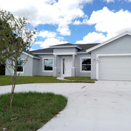 Buy this 4 bed house on 112 Southwest Carter Avenue in Port Saint Lucie, FL 34983