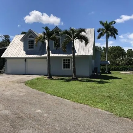 Buy this 4 bed house on 3906 1st Avenue Southwest in Collier County, FL 34117