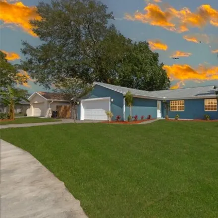 Buy this 4 bed house on 2185 Tarrytown Lane Northeast in Palm Bay, FL 32905