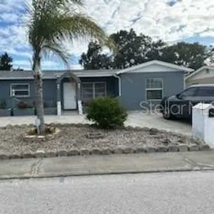 Buy this 3 bed house on 8116 Durham Drive in Jasmine Estates, FL 34668