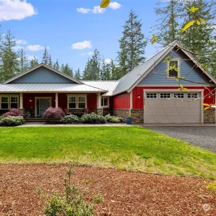 Buy this 4 bed house on 6272 Minnig Lane Northwest in Kitsap County, WA 98380