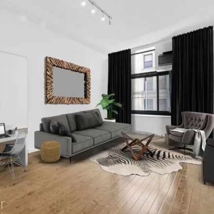 Buy this studio apartment on Fifth Ave Barber Shop in 1 West 35th Street, New York