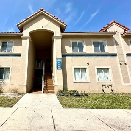 Rent this 3 bed apartment on 1068 Golden Lakes Boulevard in Golden Lakes, Palm Beach County
