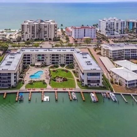 Buy this 2 bed condo on Coquina Club in Gulf Shore Boulevard North, Naples