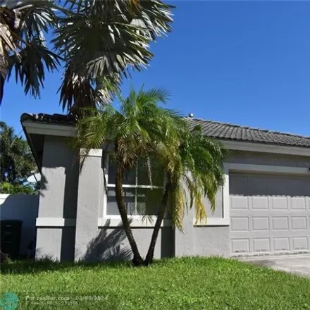 Rent this 3 bed house on 9785 Red Heart Lane in Tamarac, FL 33321