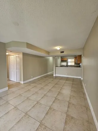 Rent this 3 bed condo on 1648 Windorah Way in Golden Lakes, Palm Beach County