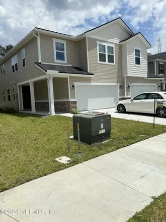 Rent this 3 bed townhouse on 6847 Mirage St in Jacksonville, Florida