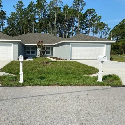 Rent this 4 bed house on 2 Louvet Lane in Palm Coast, FL 32137