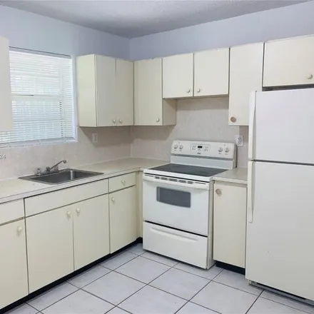 Rent this 3 bed apartment on 220 Northwest 59th Street in Edison Center, Miami