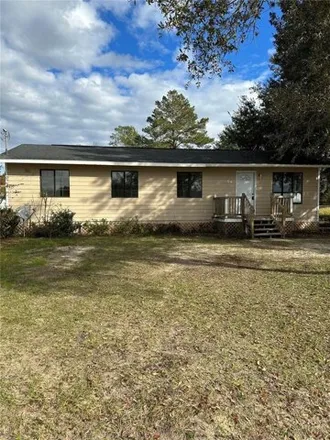 Rent this 3 bed house on 50 Cypress Road in Silver Springs Shores, Marion County