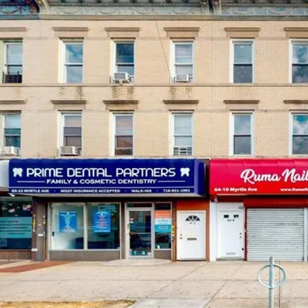Buy this 6 bed house on 64-10 Myrtle Ave Unit Multifamil in New York, 11385