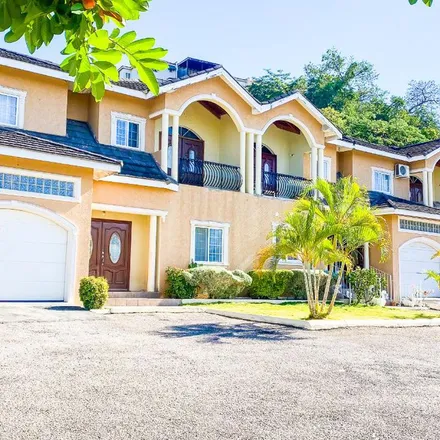 Rent this 3 bed townhouse on Paradise Crescent in Mango Walk Country Club, Jamaica