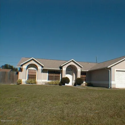 Rent this 3 bed house on 1963 Cleveland St Ne in Palm Bay, Florida