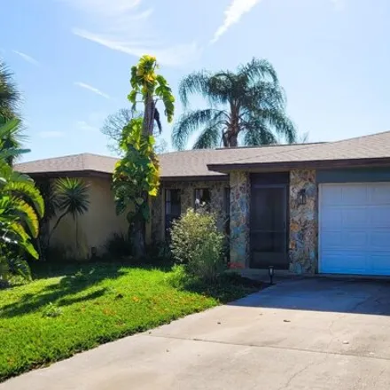 Buy this 3 bed house on 898 Douglas Street Southeast in Palm Bay, FL 32909