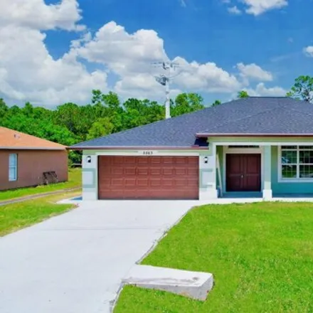 Buy this 4 bed house on 5563 NW Mecca Ct in Port Saint Lucie, Florida
