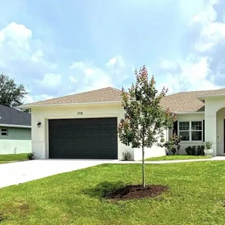 Rent this 4 bed house on 1719 SW Bradway Ln in Port Saint Lucie, Florida