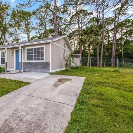 Buy this 3 bed house on 410 Tunis Road Southwest in Palm Bay, FL 32908