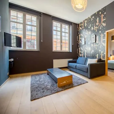 Rent this 3 bed apartment on Versailles Palace in Rue du Marché aux Poulets - Kiekenmarkt, 1000 Brussels
