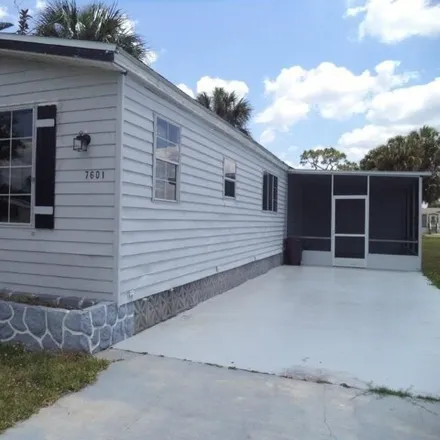 Buy this studio apartment on 7579 Grady Drive in Suncoast Estates, Lee County