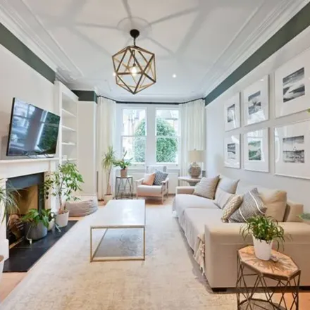 Image 3 - 21 Southdean Gardens, London, SW19 6NS, United Kingdom - Townhouse for rent