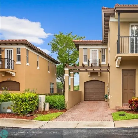 Rent this 3 bed townhouse on Julia Gardens Drive in Coconut Creek, FL 33073