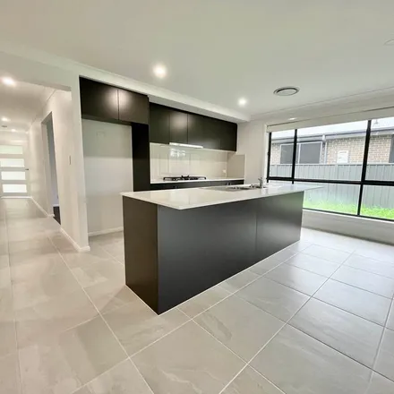 Rent this 4 bed apartment on 23 Stonebark Court in Greta NSW 2334, Australia