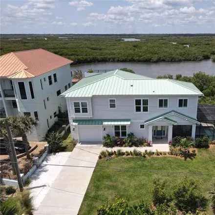 Buy this 3 bed house on 6102 Turtlemound Road in Bethune Beach, New Smyrna Beach