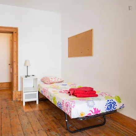 Rent this 4 bed room on Taberna Albricoque in Rua dos Caminhos de Ferro, 1100-108 Lisbon