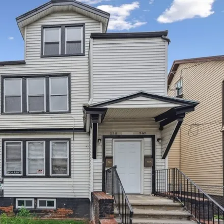 Rent this 3 bed townhouse on 379 Leslie Street in Newark, NJ 07112