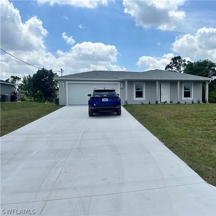 Rent this 3 bed house on Oakshire Lane in Lehigh Acres, FL 33920