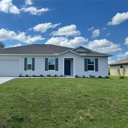 Rent this 4 bed house on 2535 24th Street West in Lehigh Acres, FL 33971