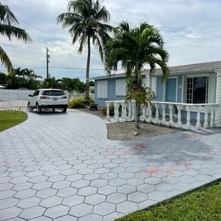 Buy this 4 bed house on 5200 Northwest 183rd Street in Miami-Dade County, FL 33055