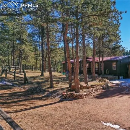 Buy this studio apartment on 2917 Lower Twin Rock Road in Teller County, CO 80816