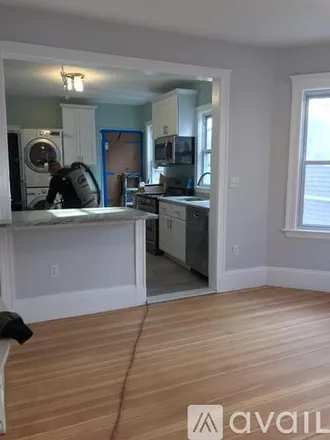 Rent this 4 bed condo on 11 Atkins St