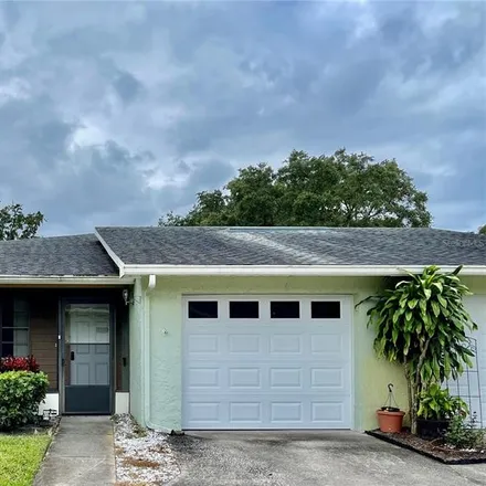 Buy this 2 bed house on 1141 Orange Tree Circle West in Palm Harbor, FL 34684
