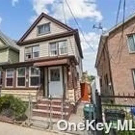 Buy this 4 bed house on 145-53 107th Avenue in New York, NY 11435