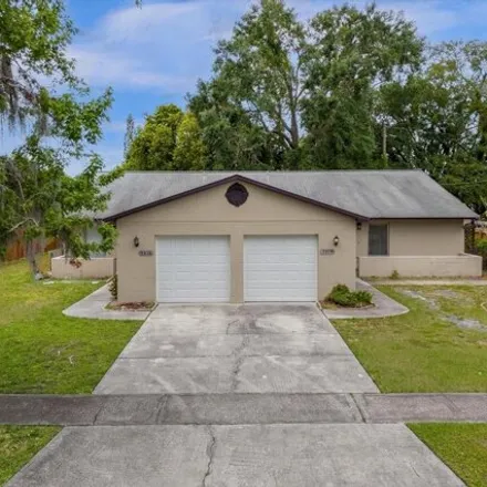 Rent this 3 bed house on 5252 Kempston Drive in Orange County, FL 32812