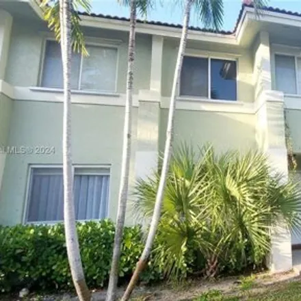 Rent this 3 bed townhouse on 145 Hidden Court Drive in Hollywood, FL 33023