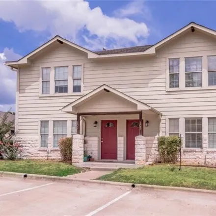 Rent this 3 bed townhouse on 111 Yegua Circle in Huntsville, TX 77340