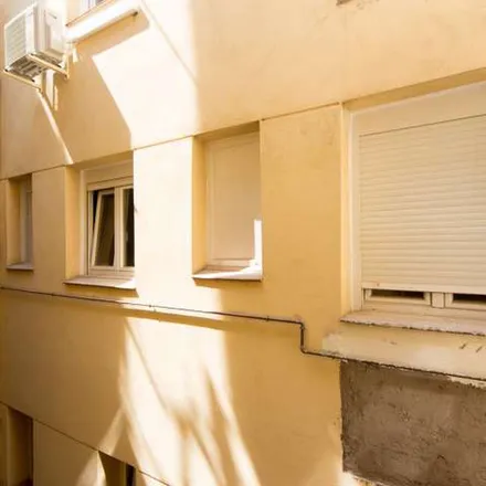Rent this 6 bed apartment on Madrid in Ni Subo Ni Bajo, Calle de García de Paredes