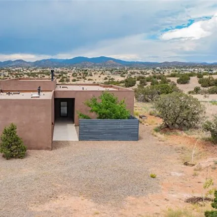 Buy this 3 bed house on 27 Spur Ranch Road in Eldorado at Santa Fe, NM 87540