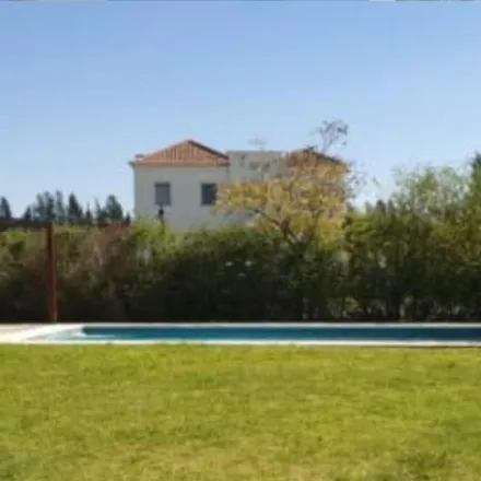 Rent this 4 bed house on unnamed road in Partido de Tigre, 1617 General Pacheco