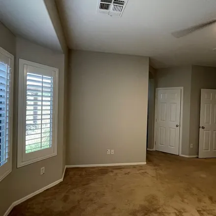 Rent this 4 bed apartment on 3688 North 143rd Lane in Goodyear, AZ 85395