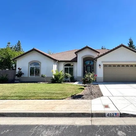 Rent this 4 bed house on 412 West Chennault Avenue in Clovis, CA 93611
