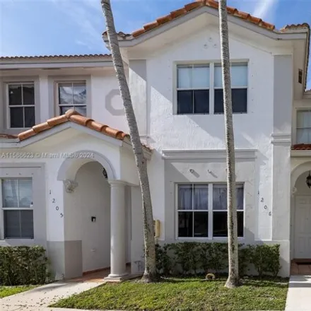 Rent this 4 bed townhouse on 5570 Northwest 107th Avenue in Doral, FL 33178
