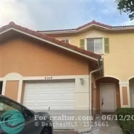 Rent this 3 bed townhouse on 8304 Santa Monica Ave Unit 8304 in Tamarac, Florida