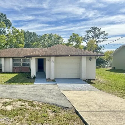 Rent this 3 bed house on 1368 Mariner Boulevard in Spring Hill, FL 34609